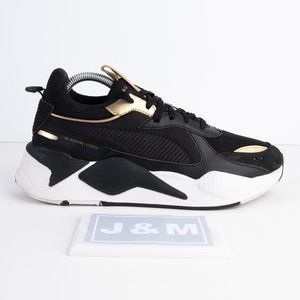 black puma shoes with gold